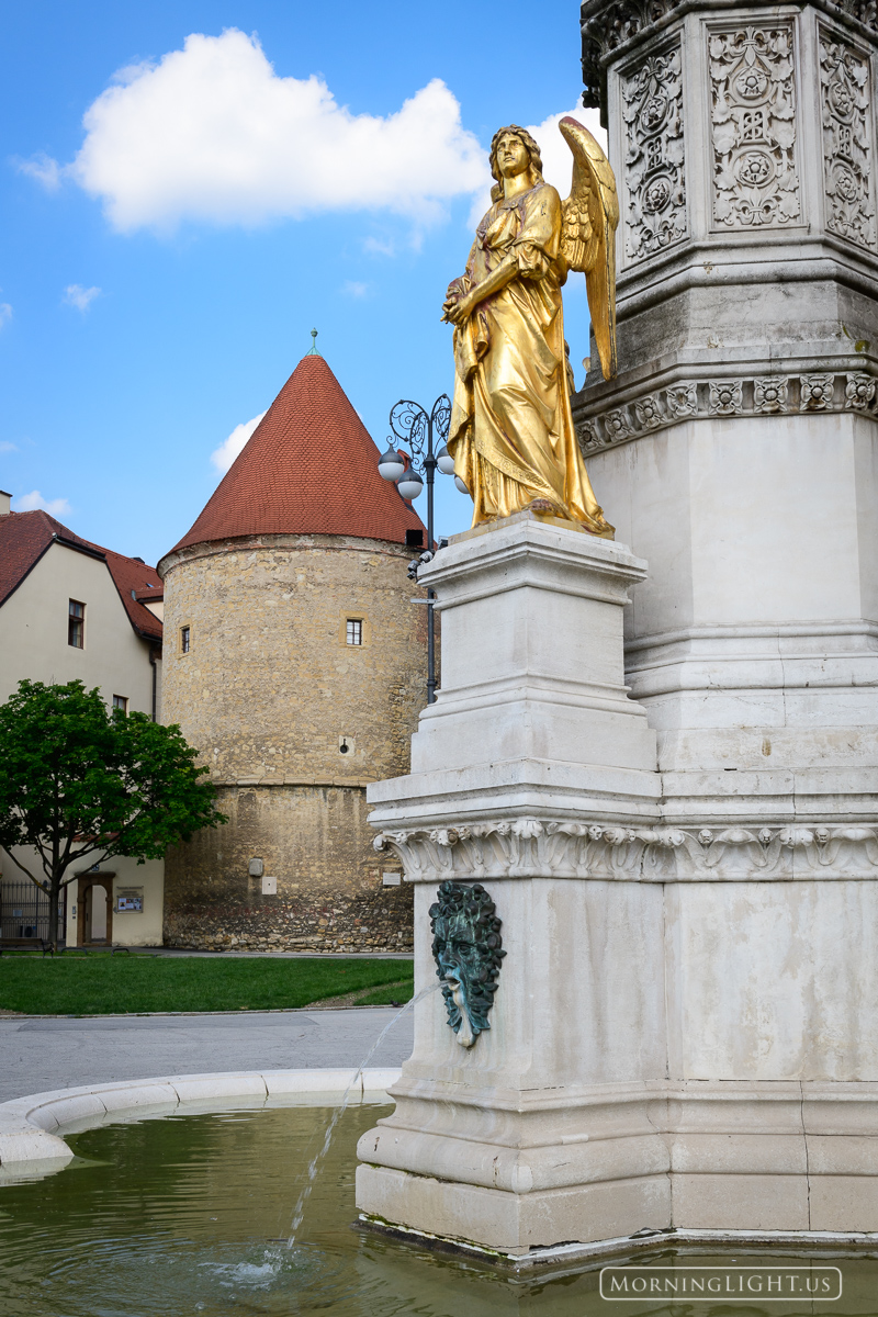 A golden angel stands guard outside the cathedral in central Zagreb, Croatia
