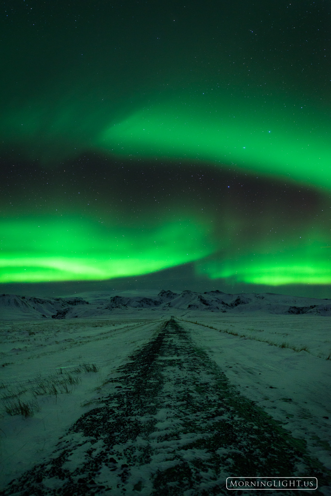 Aurora Road-V On an icy night in Iceland when no one was watching magical lights took to the sky and danced to a silent melody.