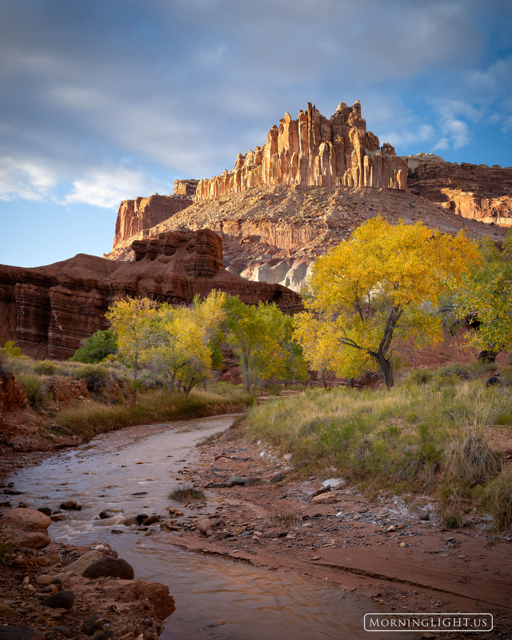 On a gorgeous autumn evening the rock formation known as "The Castle" in Capitol Reef National Park glows as it catches the long...