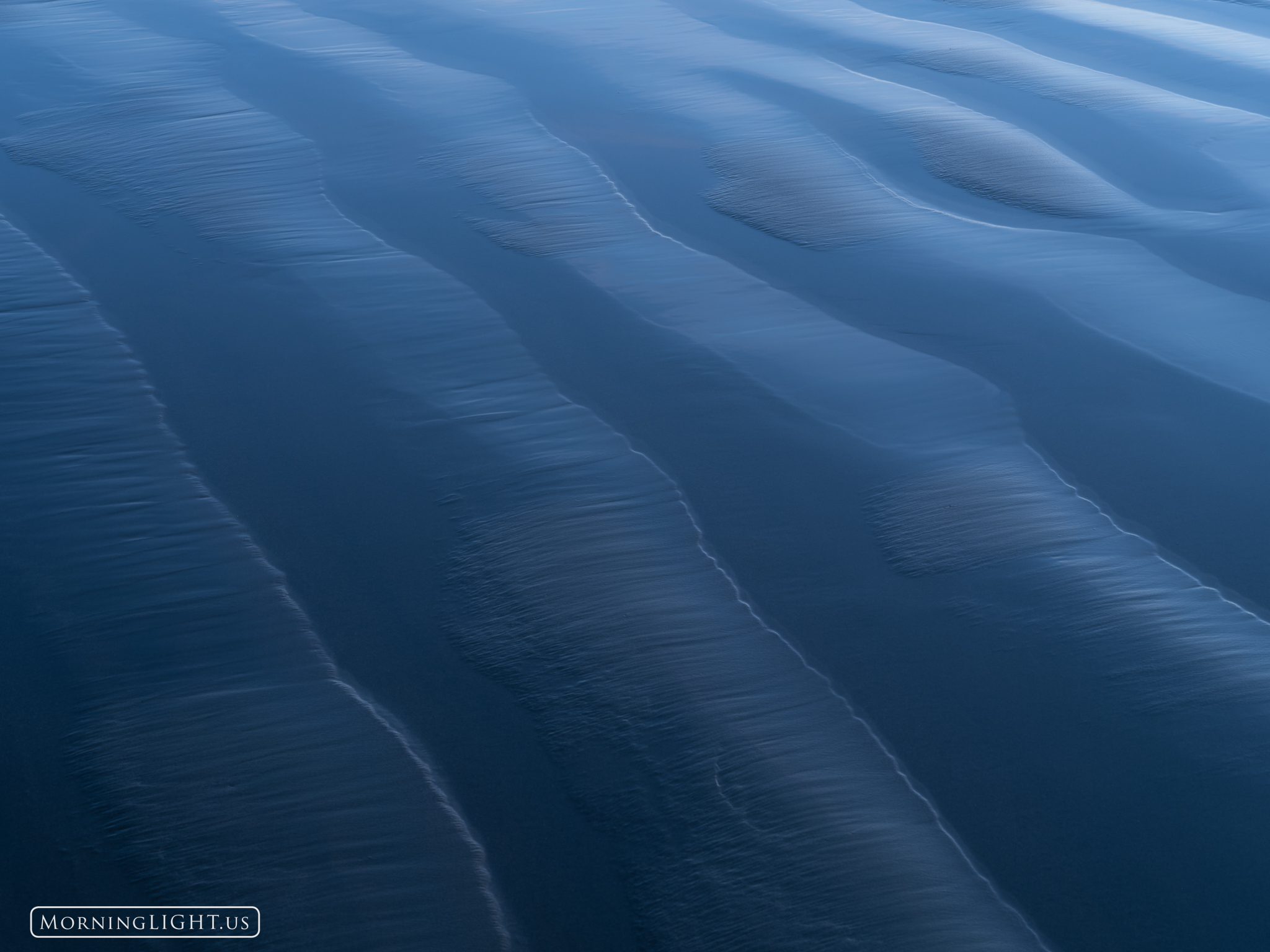 Along the beach in Morrow Bay, California, I spent an evening photographing ripples in the sand. After the sun set, the deep...