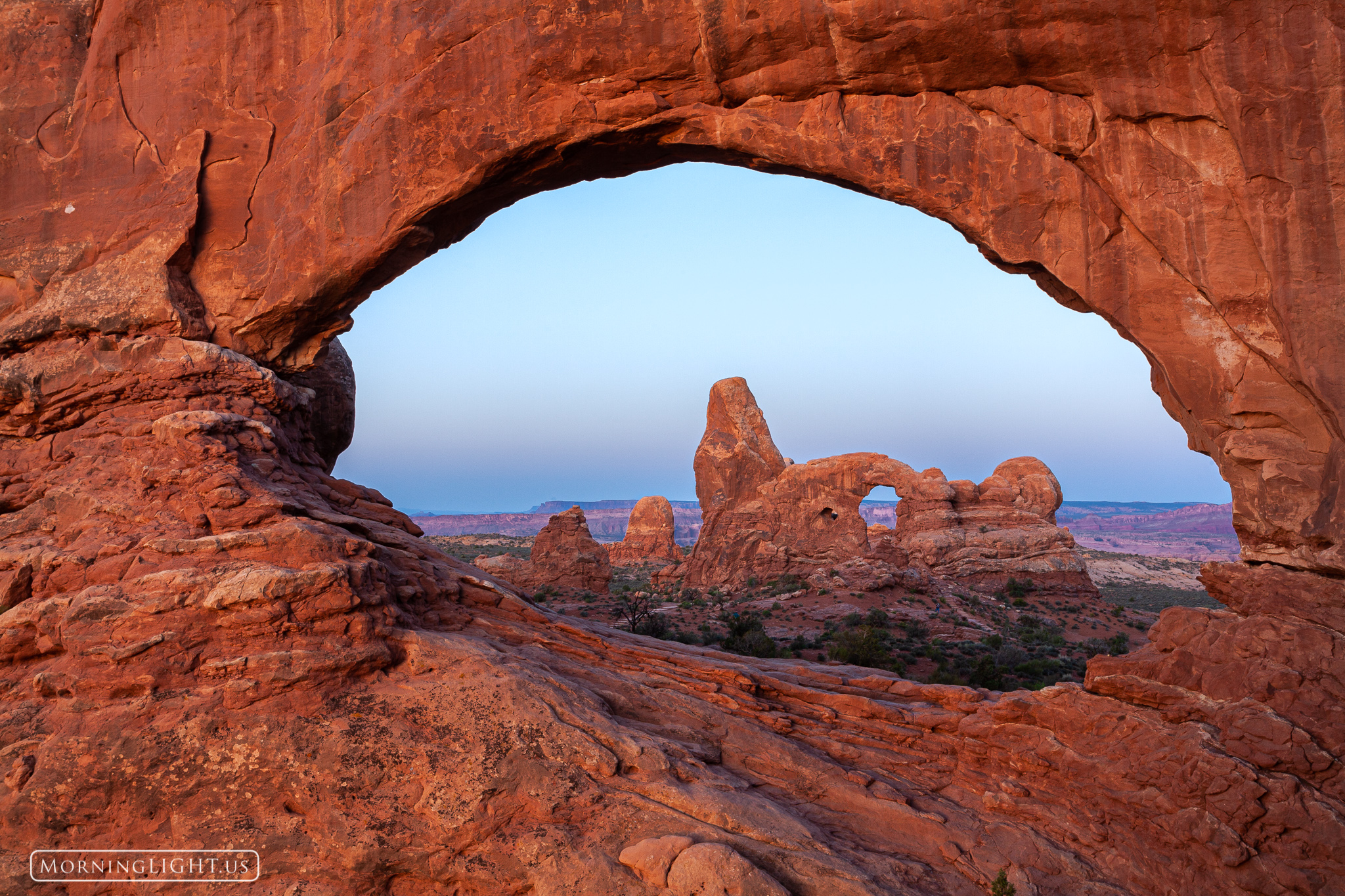 This is the classic view of Turret Arch as seen through the South Window in Arches National Park, taken just before sunrise.