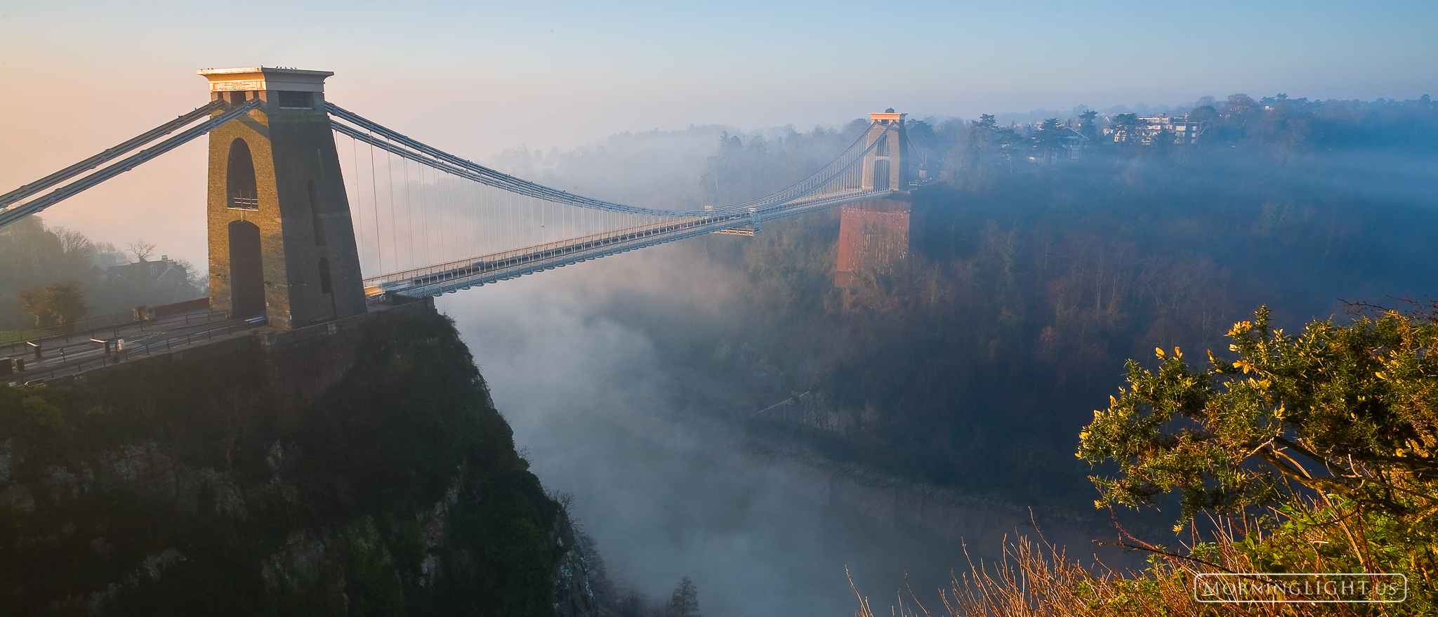 Sunrise and fog at the Clifton Suspension Bridge in Bristol, England. (This is also available in standard, non-panoramic, sizes...