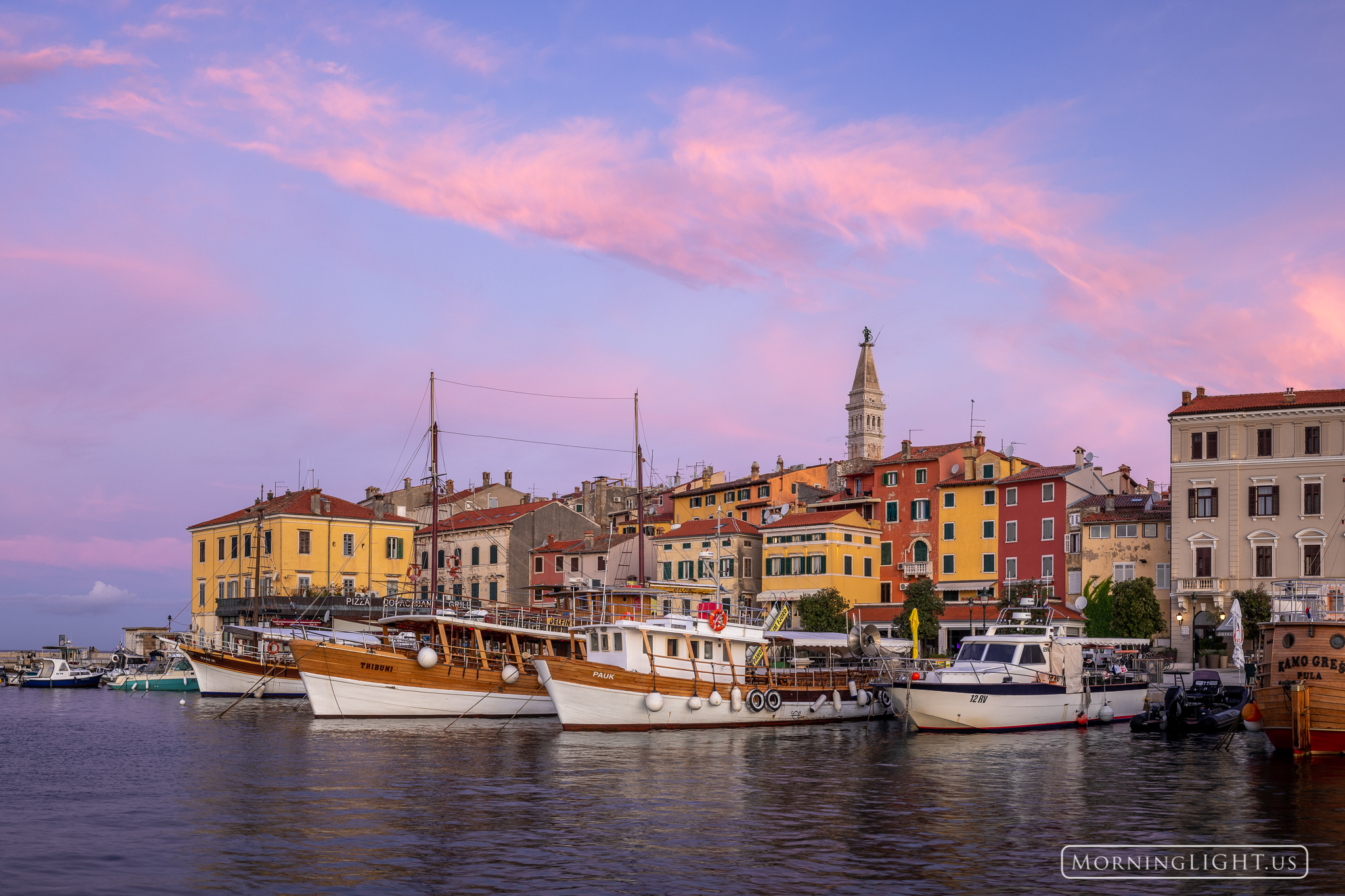 As the day began, the clouds above the little port town of Rovijn, Croatia began to glow.