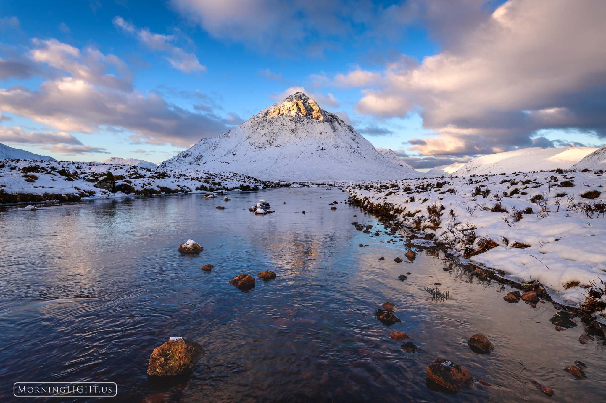Following the biggest snow storm in nearly 7 years Buachaille Etive Mor stands robed in a coat of white as the morning sun lights...