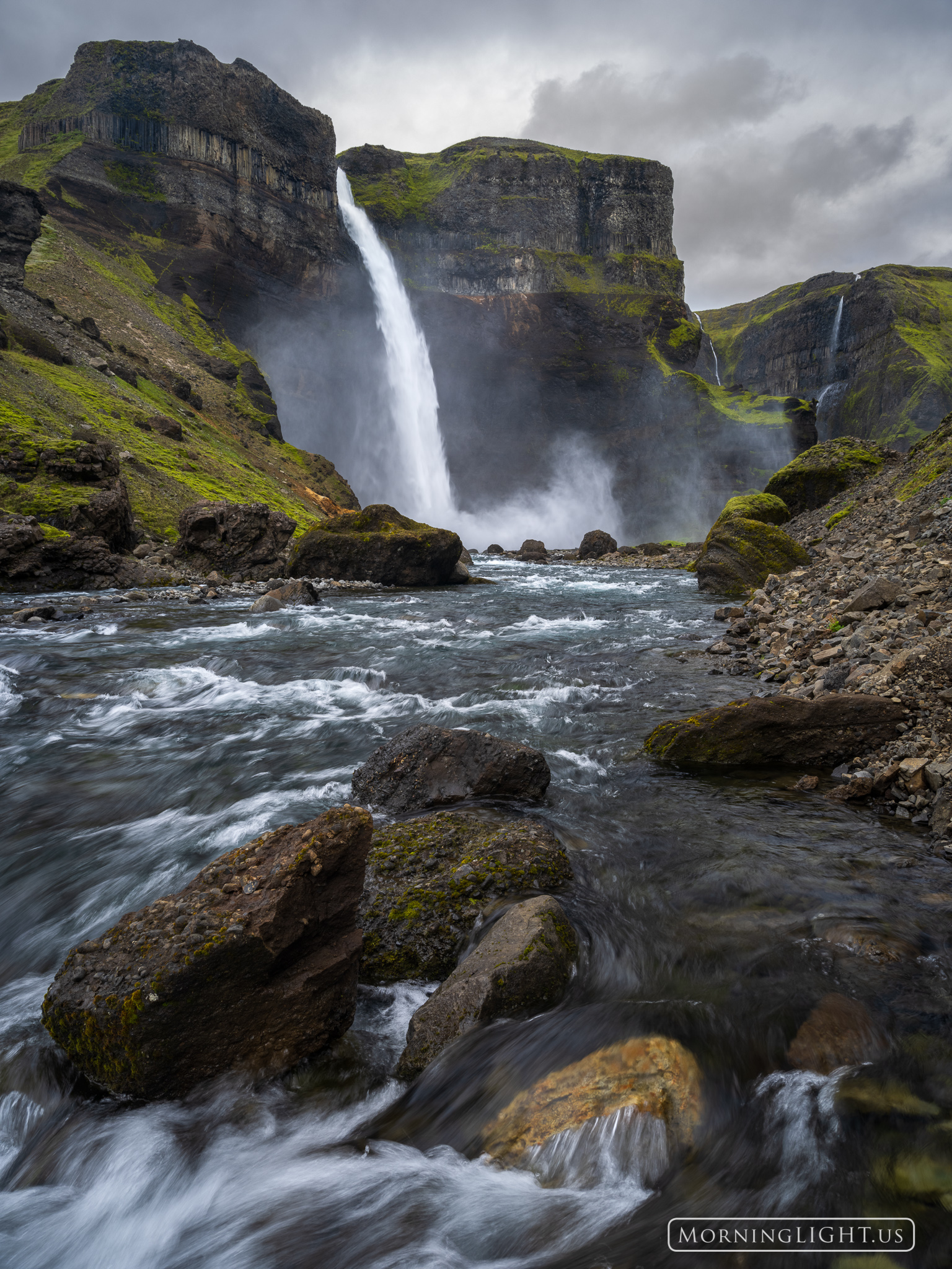 Iceland is a land overflowing with waterfalls. This one starts as a stream that wanders through the high pastureland before arriving...