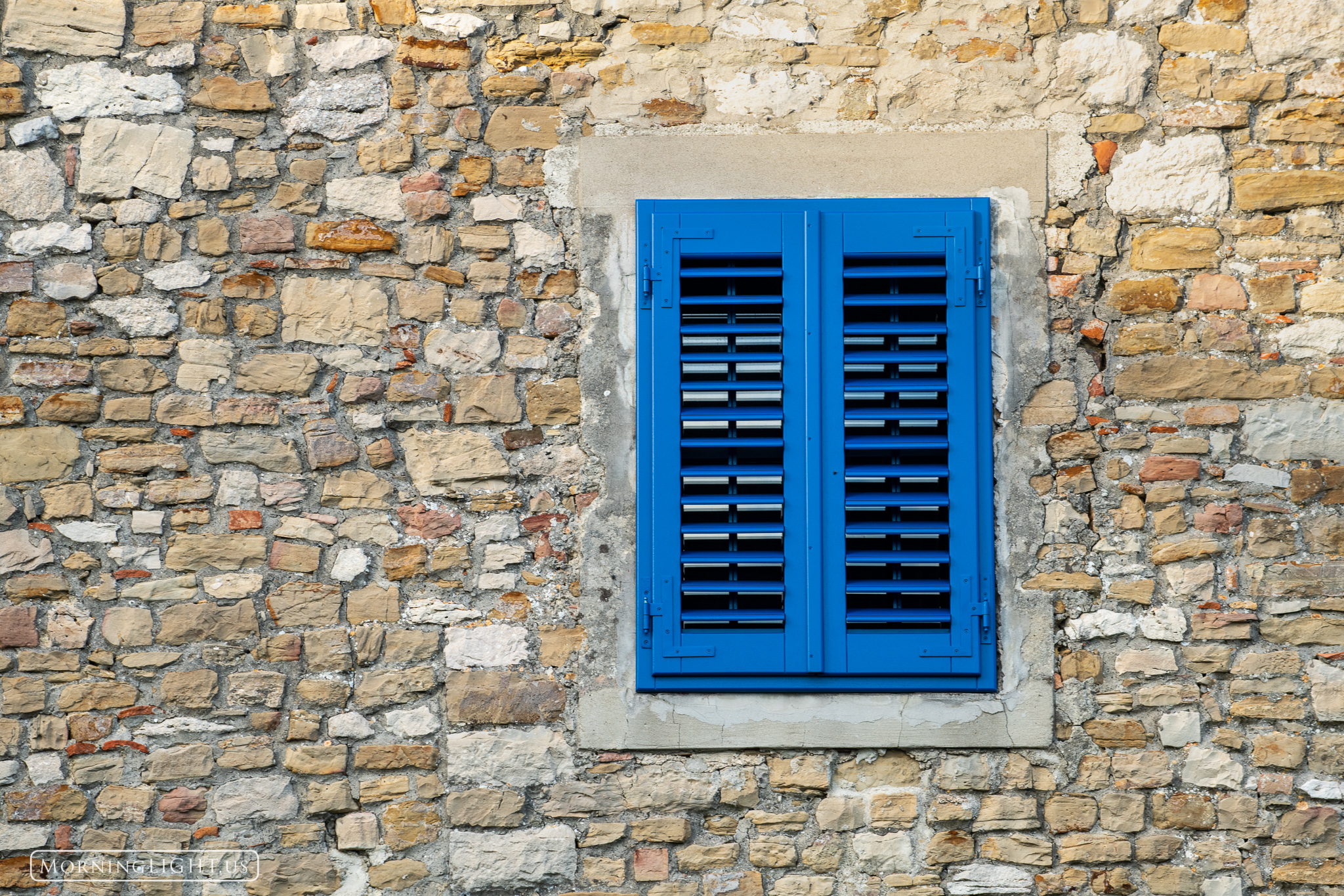 A brightly colored window in Motovun, Croatia