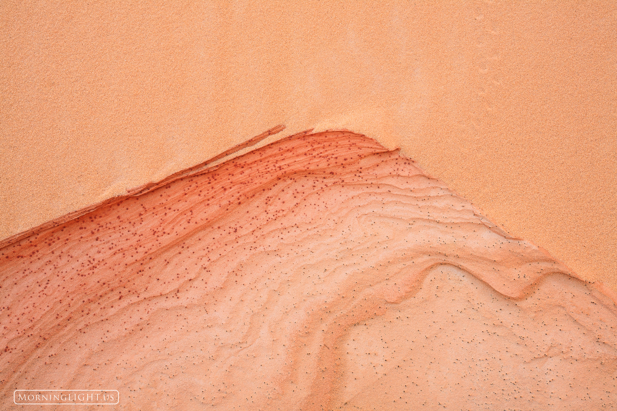 While hiking in a beautiful but remote area of northern Arizona I came across a large sand dune which intersected with a sandstone...