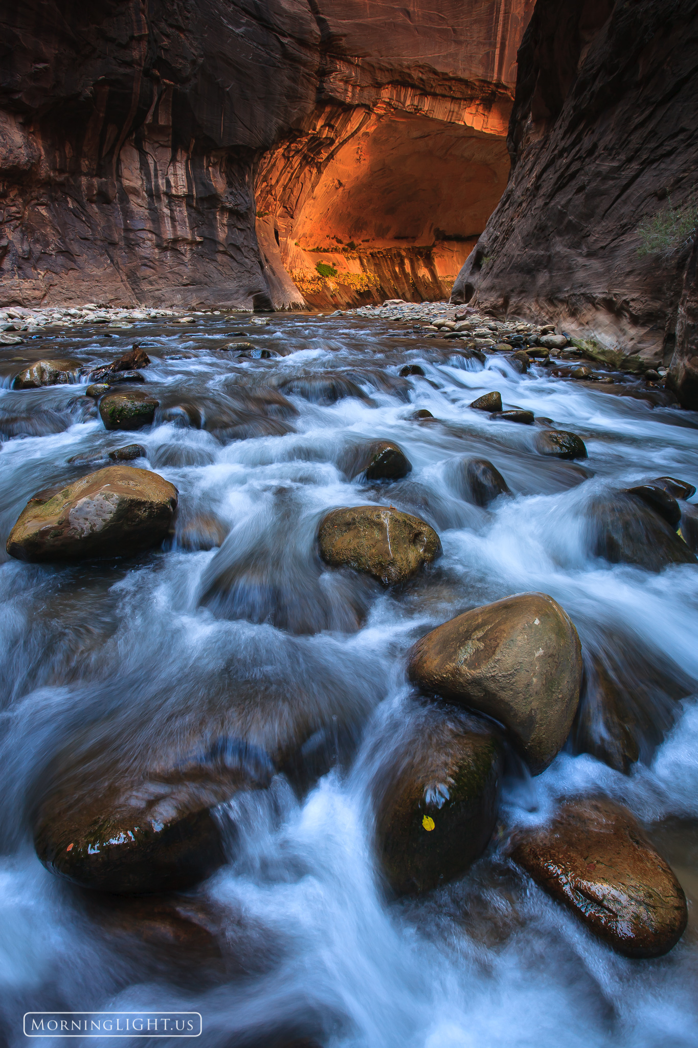 On my way out of the Narrows in Zion National Park I stopped below this cascade to enjoy the reflected glow on the walls behind...