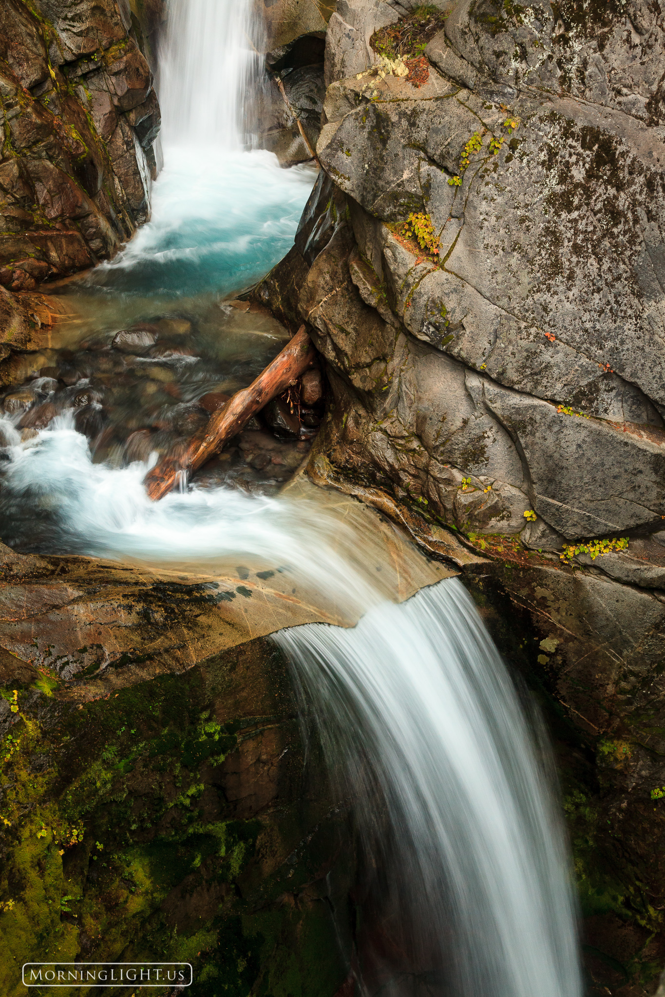 A set of waterfalls make their way down the rock near Paradise in Rainier National Park, Washington.