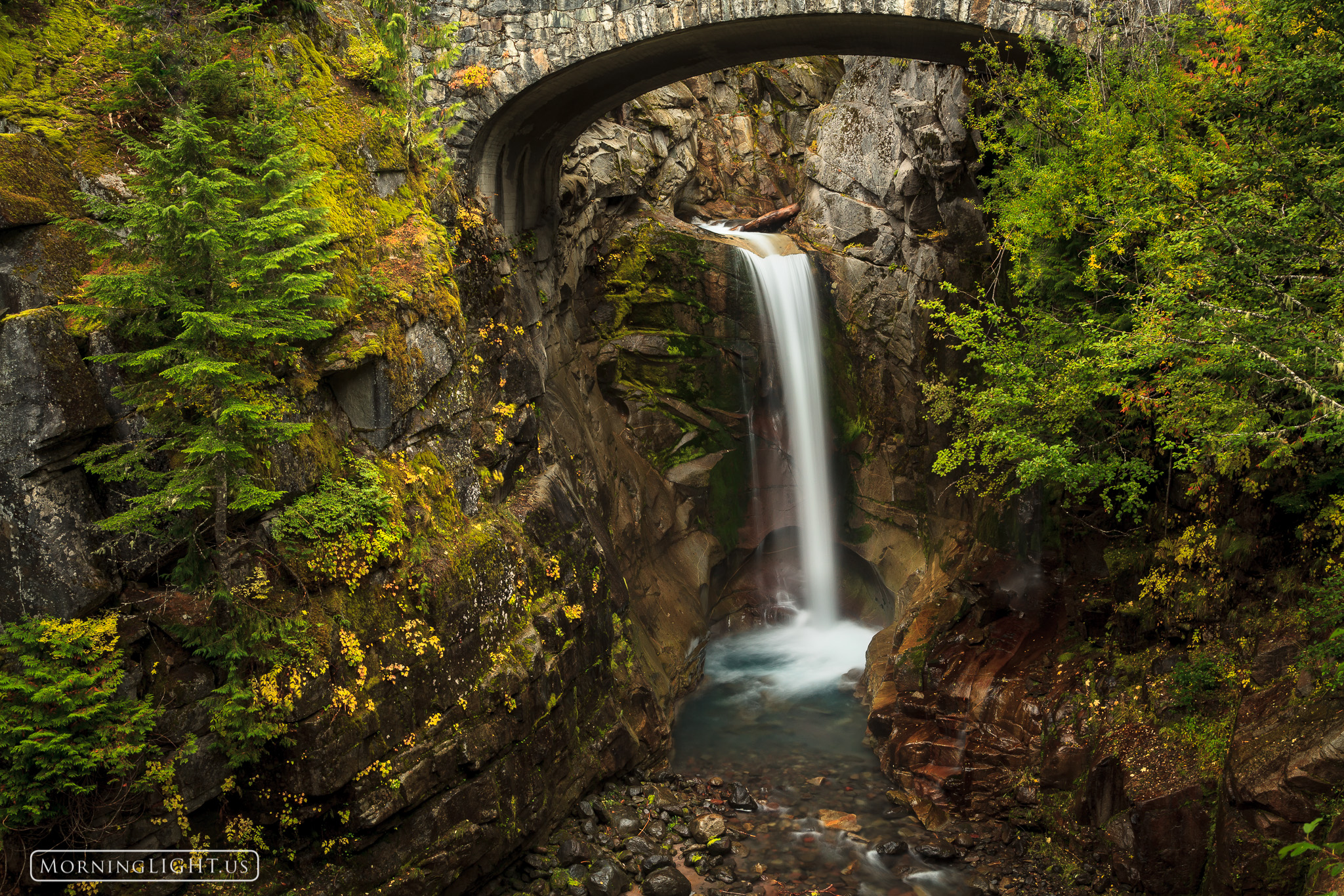 An elegant waterfall below a bridge in Mt. Rainier National Park.