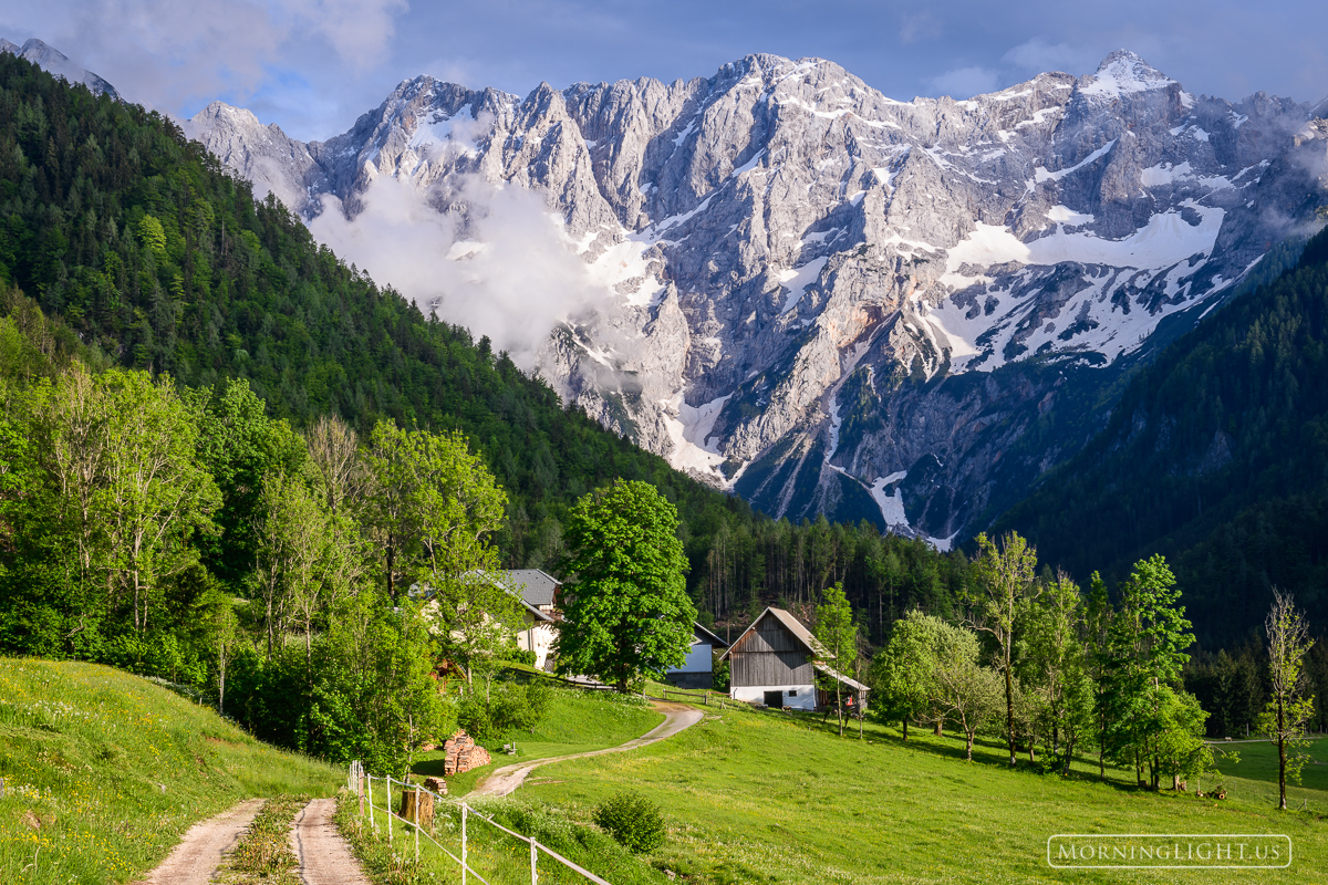 This small home is dwarfed by its dramatic setting in the Julian Alps. This image makes me dream of what it would be like to...