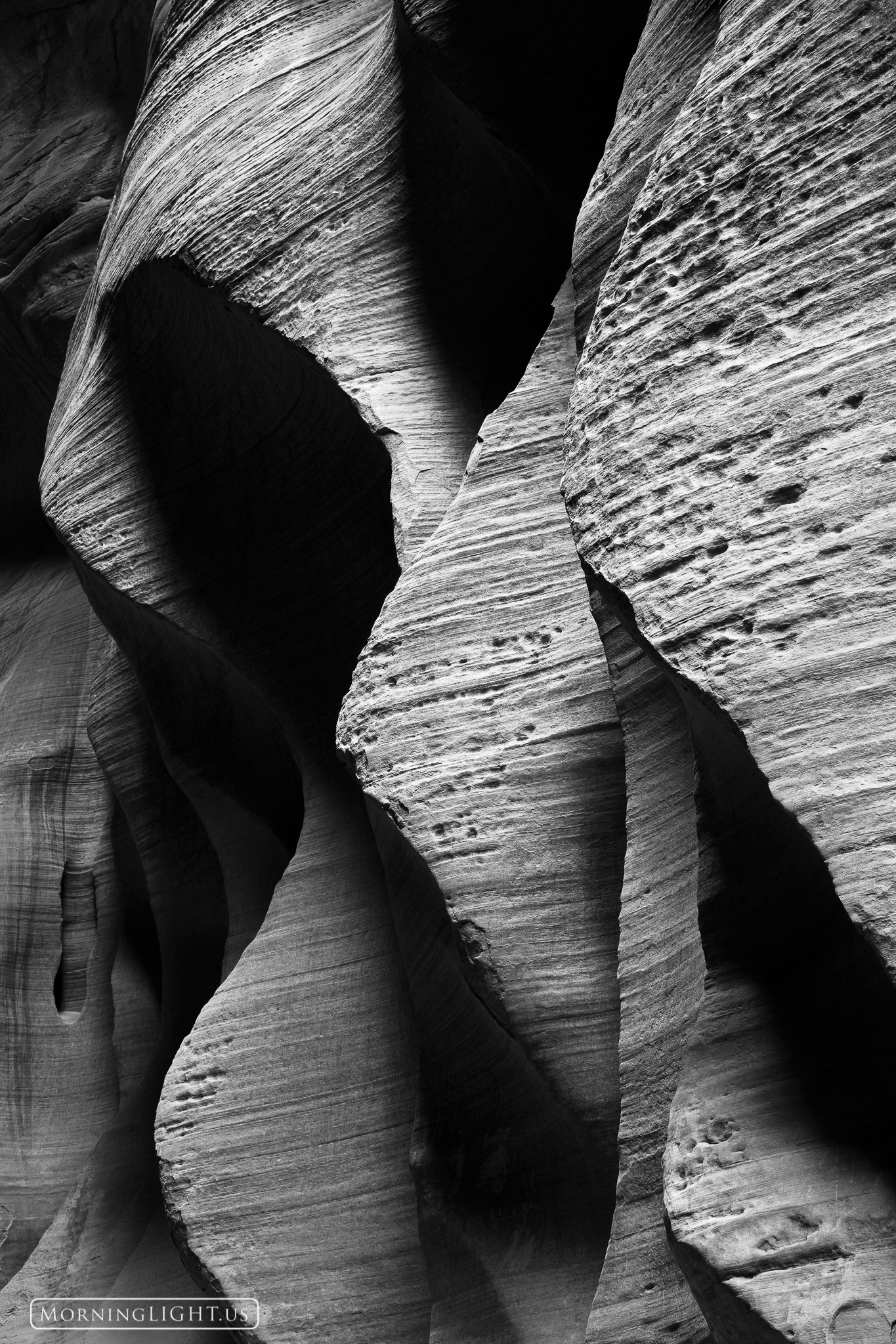 The walls of this area of Buckskin Gulch have taken on the most interesting shapes and textures with this repeating almost wave...