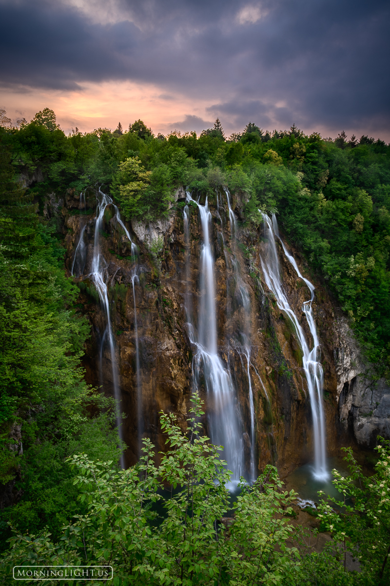 A gentle sunset over Veliki Slap in Plitvice, National Park in Croatia.
